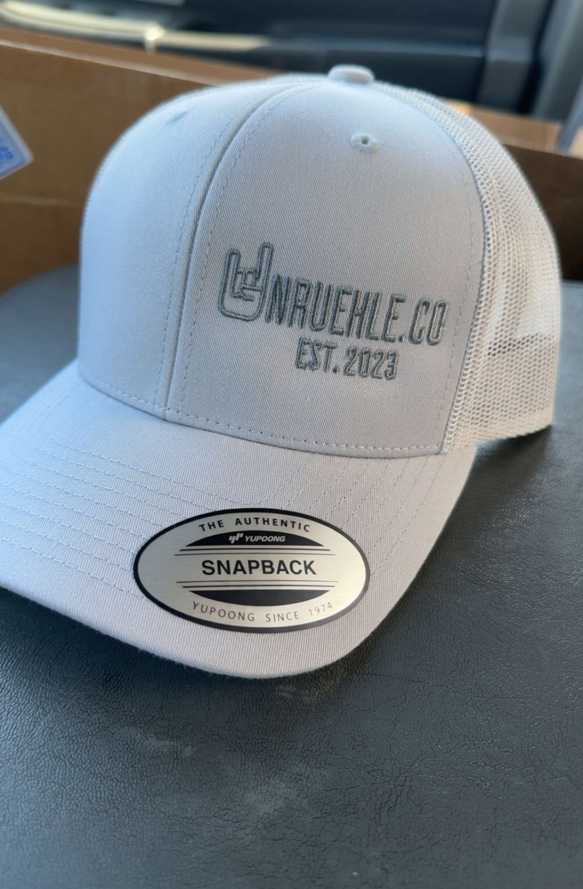 Silver UNRUEHLE.Co Trucker Hat